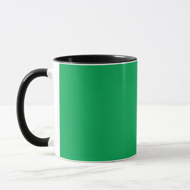 a green background with a white border mug (Left)
