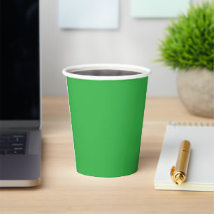 a green background with a white border paper cups