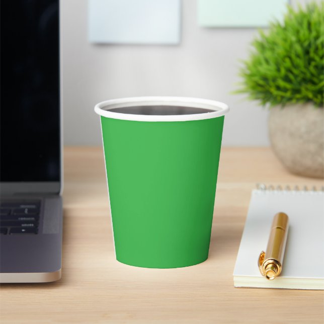 a green background with a white border paper cups (Insitu)
