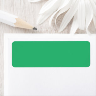 a green background with a white border return address label