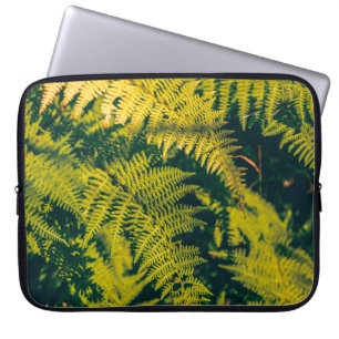 A green fern plants background with shadows. abstr laptop sleeve