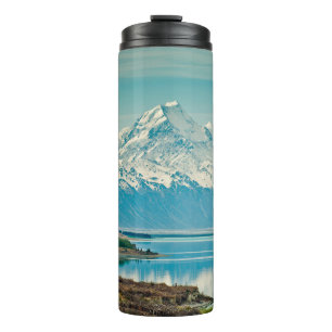 A green fern plants background with shadows. abstr thermal tumbler