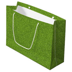 A green grass shopping bag with white handles