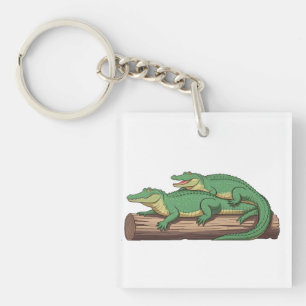 a group of alligators sunning themselves on a log" key ring