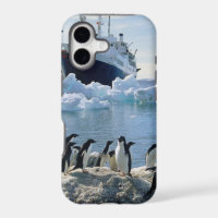 A Group Of Penguins Standing On An Icy Beach