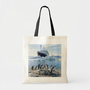 A Group Of Penguins Standing On An Icy Beach Tote Bag