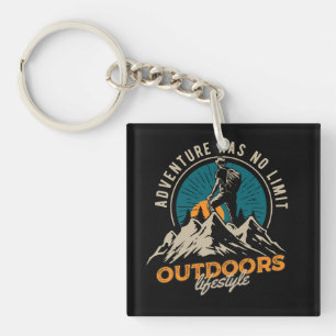 a hiker climbing to top of mountain key ring
