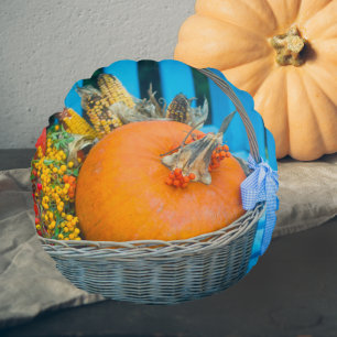 A holiday basket with pumpkins round cushion