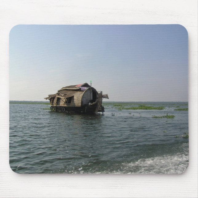 A houseboat moving placidly through a coastal lake mouse pad (Front)