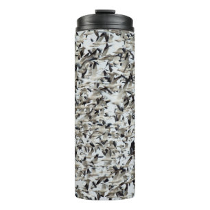 A HUGE DENSE FLOCK OF SNOW GEESE FLY TOGETHER IN T THERMAL TUMBLER