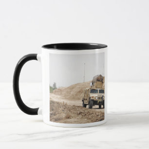 A Humvee conducts security Mug