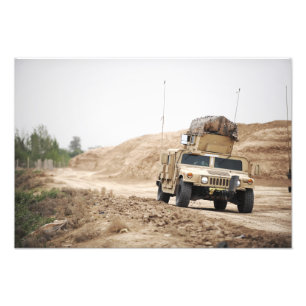 A Humvee conducts security Photo Print
