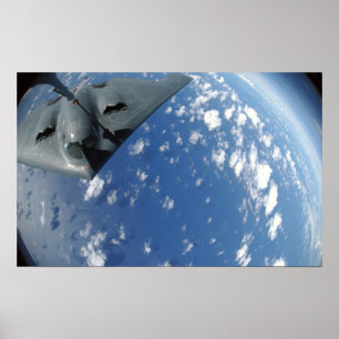 A KC-135 Stratotanker refuels a B-2 Spirit Poster