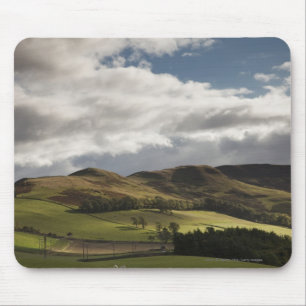 A Landscape With Rolling Hills And Clouds Overhead Mouse Pad