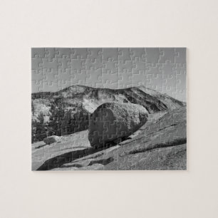 A large boulder - a glacial erratic - is perched jigsaw puzzle