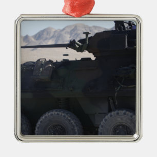 A light armoured vehicle fires metal tree decoration