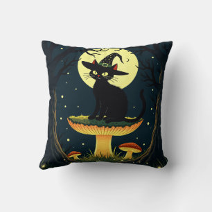 A Little Black Witchy Cat Sitting On A Toadstool Cushion