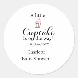 A little cupcake is on its way baby shower name da classic round sticker