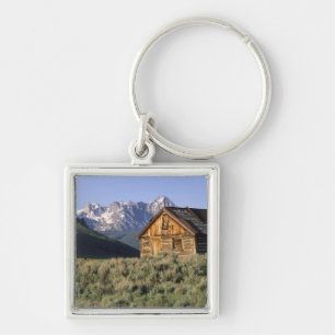 A log cabin and the Sawtooth Mountains in Key Ring