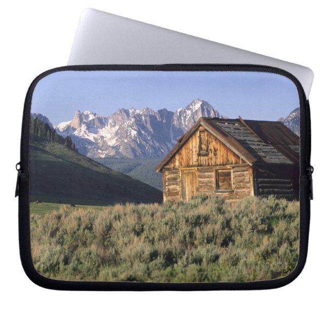 A log cabin and the Sawtooth Mountains in Laptop Sleeve (Front)