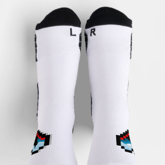 A lone figure sitting on a mountain socks