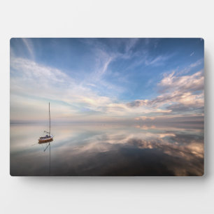 A Lone Sailboat On The Calm Waters Of Salton Plaque