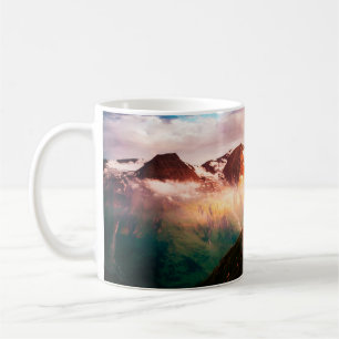 A look at the sunlit hills at twilight. Dramatic e Coffee Mug