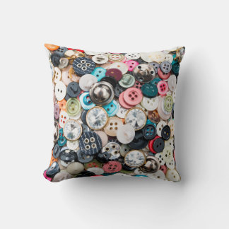A lot of colorful sewing buttons of different colo cushion
