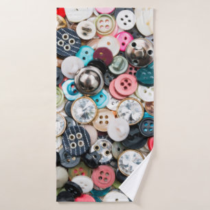 A lot of colourful sewing buttons of different col bath towel
