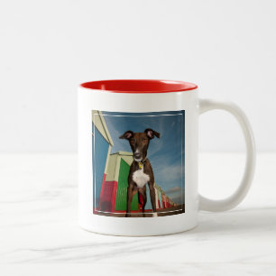 A Lurcher Standing In Front Of Some Beach Huts Two-Tone Coffee Mug