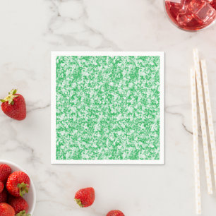 A lush, green fern with delicate, arching fronds f napkin