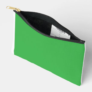 A lush landscape filled with dense green trees and accessory pouch