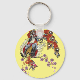 a magical phoenix sitting on a blossom sakura keyc key ring