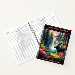 A majestic moose by a vibrant waterfall at dusk notebook