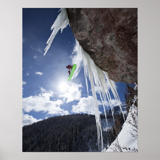 A male snowboarder jumps off an ice waterfall poster (Front)