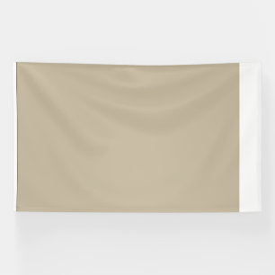 a man in a suit and tie standing in front of a wal banner