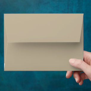 a man in a suit and tie standing in front of a wal envelope