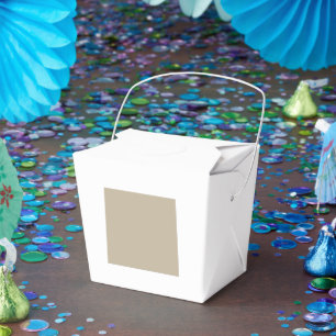 a man in a suit and tie standing in front of a wal favour box