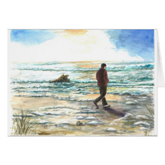 A man in thought at the beach