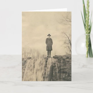 A man on a cliff card