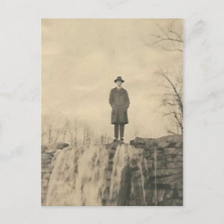 A man on a cliff postcard