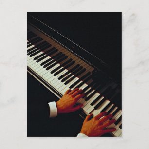 A man playing piano postcard