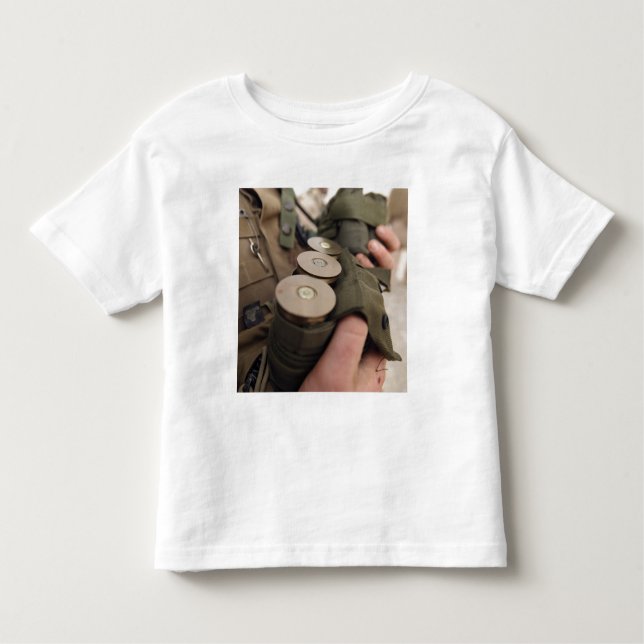 A Marine cradles handfuls of 40 mm grenades Toddler T-Shirt (Front)