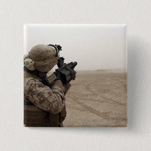 A Marine fires the M-32 15 Cm Square Badge
