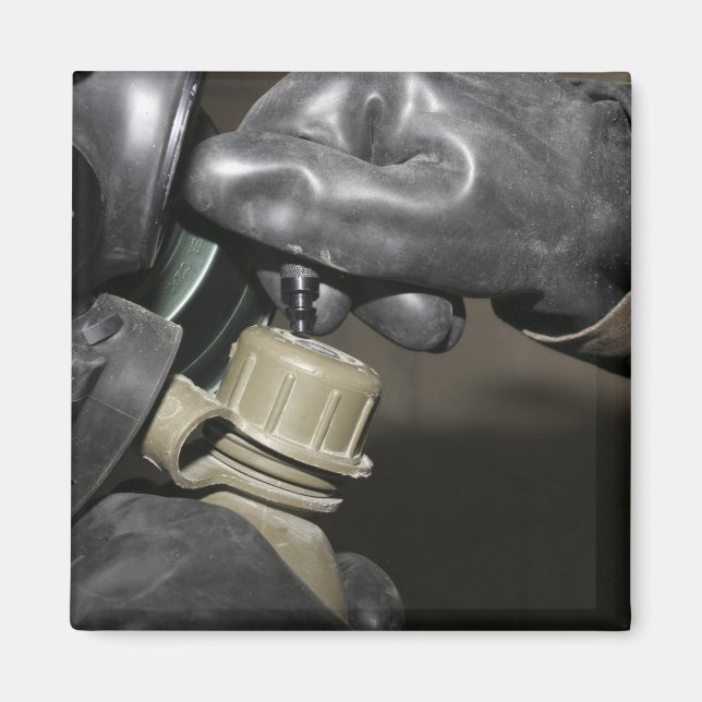 A Marine inserts a drinking tube into his cante Magnet (Front)