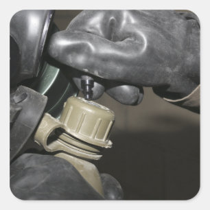 A Marine inserts a drinking tube into his cante Square Sticker