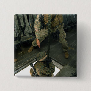 A Marine sends a fellow Marine down the hell ho 15 Cm Square Badge