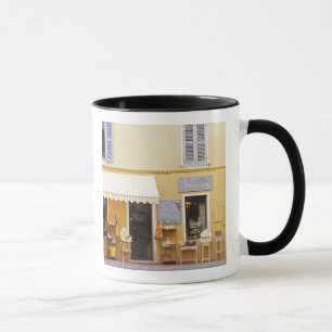 A market street in the old town with a shop mug