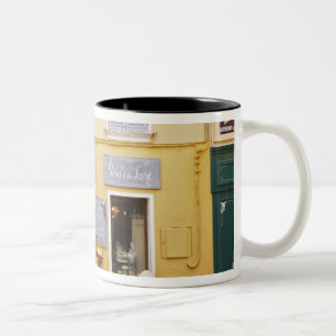 A market street in the old town with a shop Two-Tone coffee mug