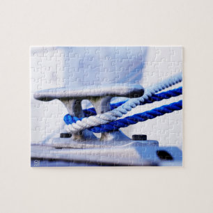 A metal boat clamp with a line wrapped around it jigsaw puzzle